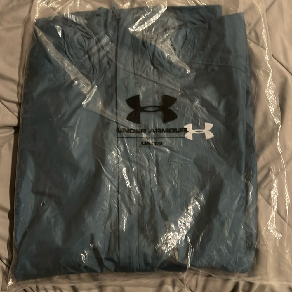 Under armour zip up jacket. Lightweight rain jacket.